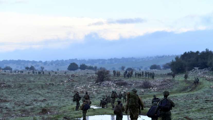Israeli soldiers take part in training session near the Israel border with Syria at the Israeli-occupied Golan Heights