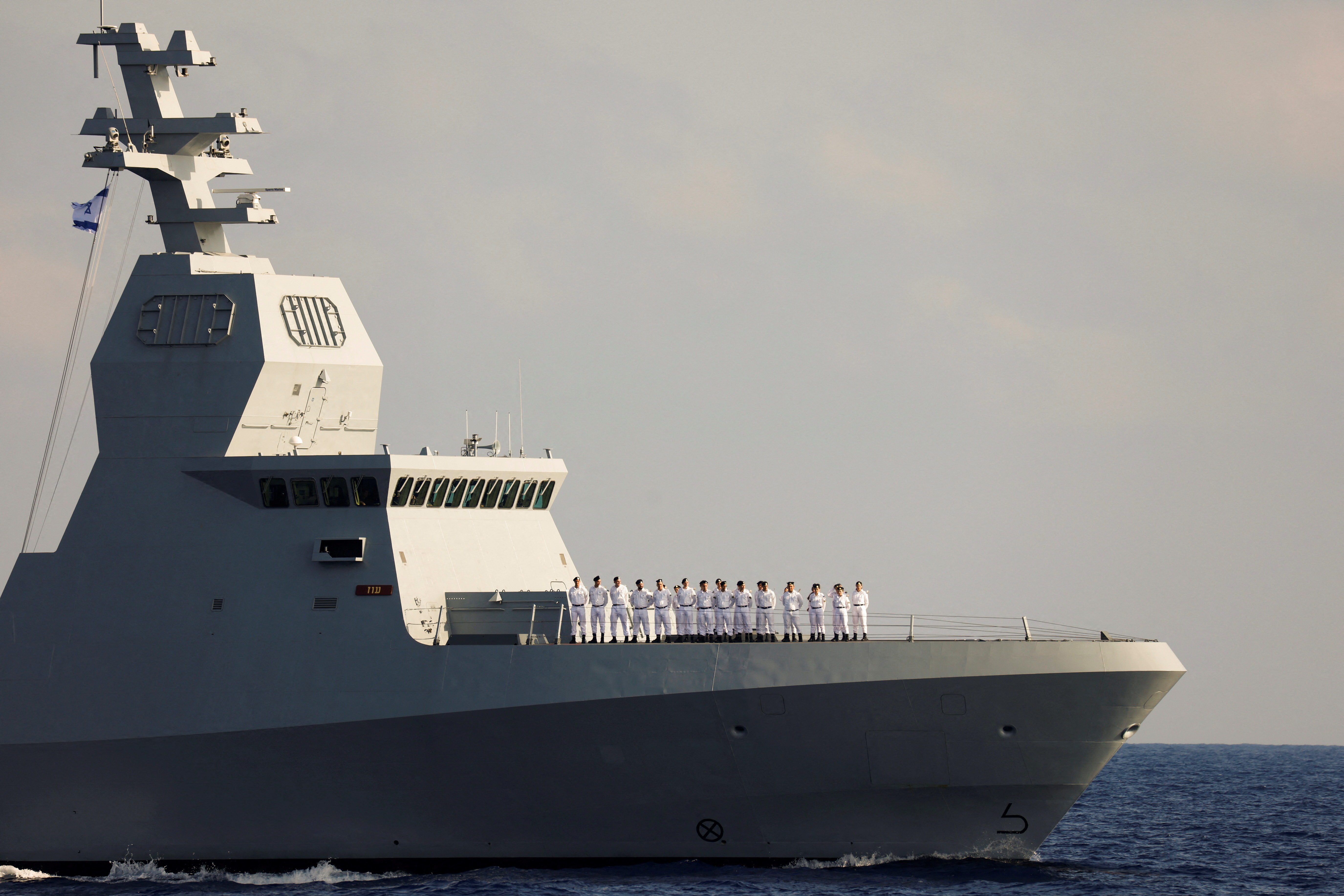 FILE PHOTO: Israeli sailors stand in formation on Israel's second Saar-6 corvette, a warship dubbed "Oz", before a welcoming ceremony by the Israeli navy to mark its arrival, in the Mediterranean Sea, off the coast of Haifa