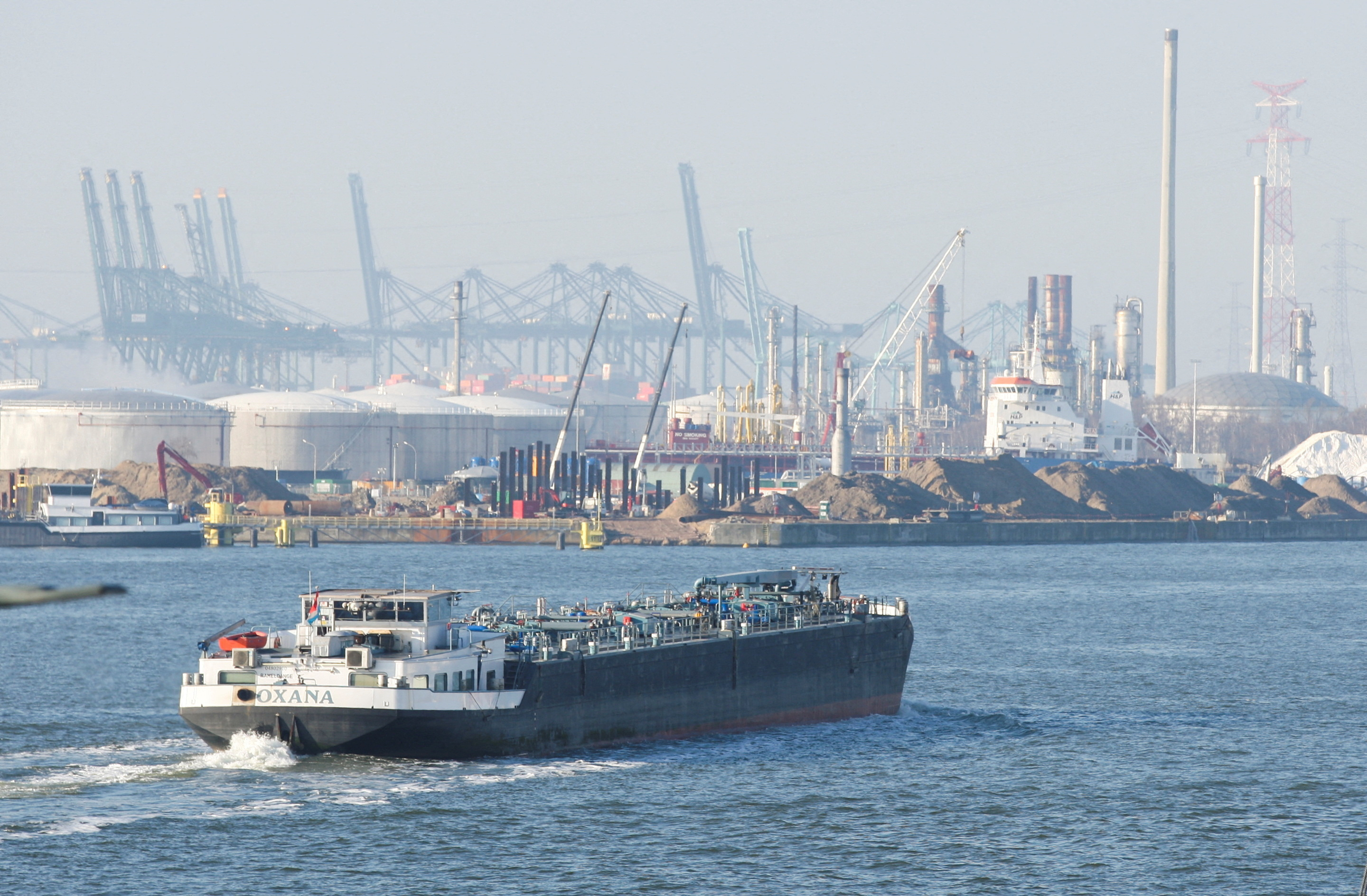 A ship cruises at the port of Antwerp