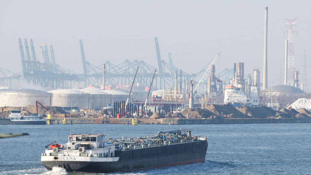 A ship cruises at the port of Antwerp