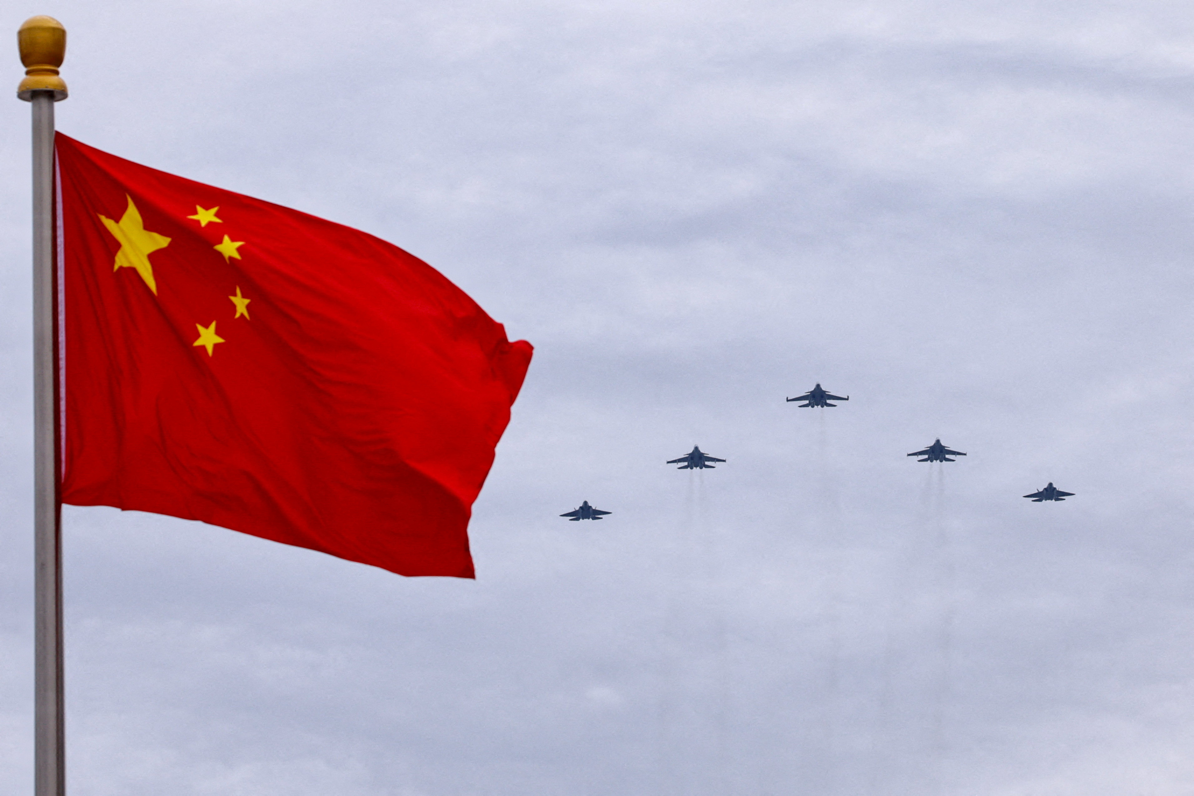 FILE PHOTO: Flyover rehearsal ahead of a military parade to mark the 80th anniversary of the end of World War Two, in Beijing
