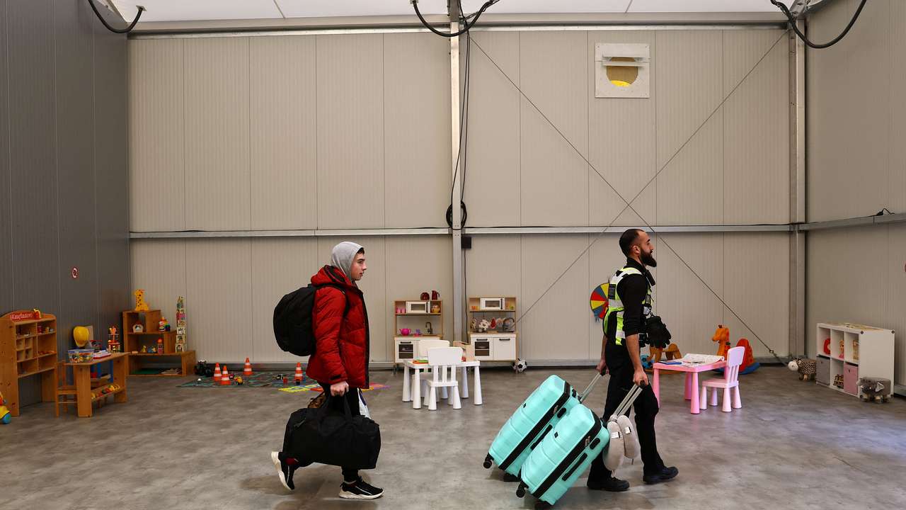 FILE PHOTO: Ukrainian refugees arrive at a temporary shelter in Hanau