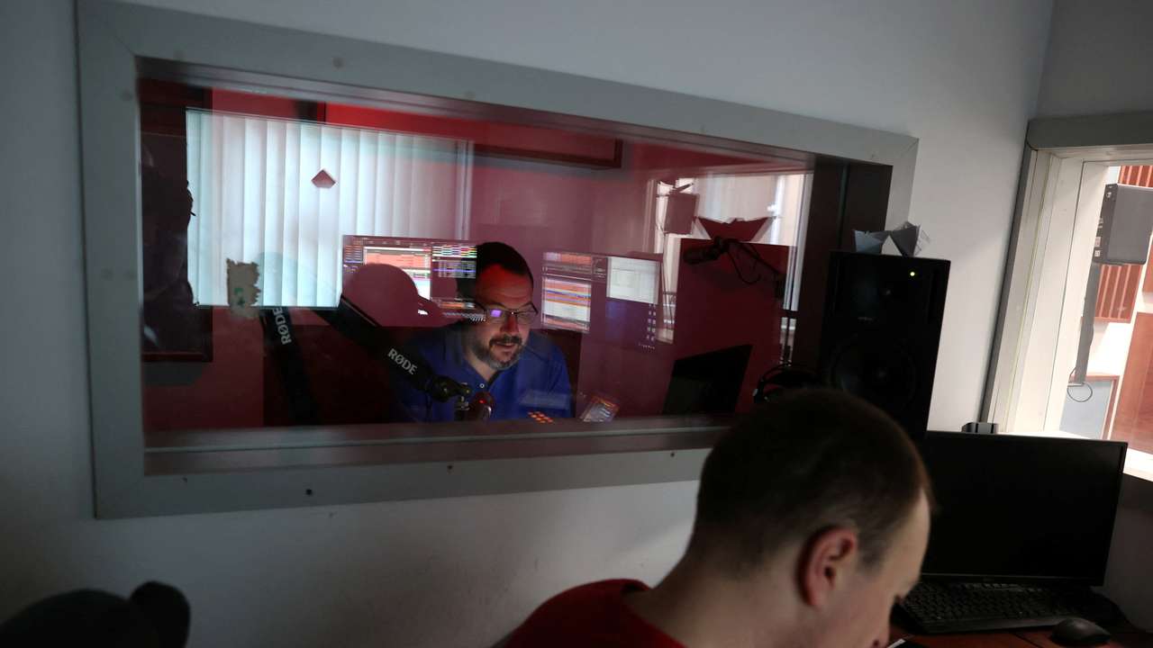 Employees of the Hungarian radio station Klubradio work at its headquarters in Budapest