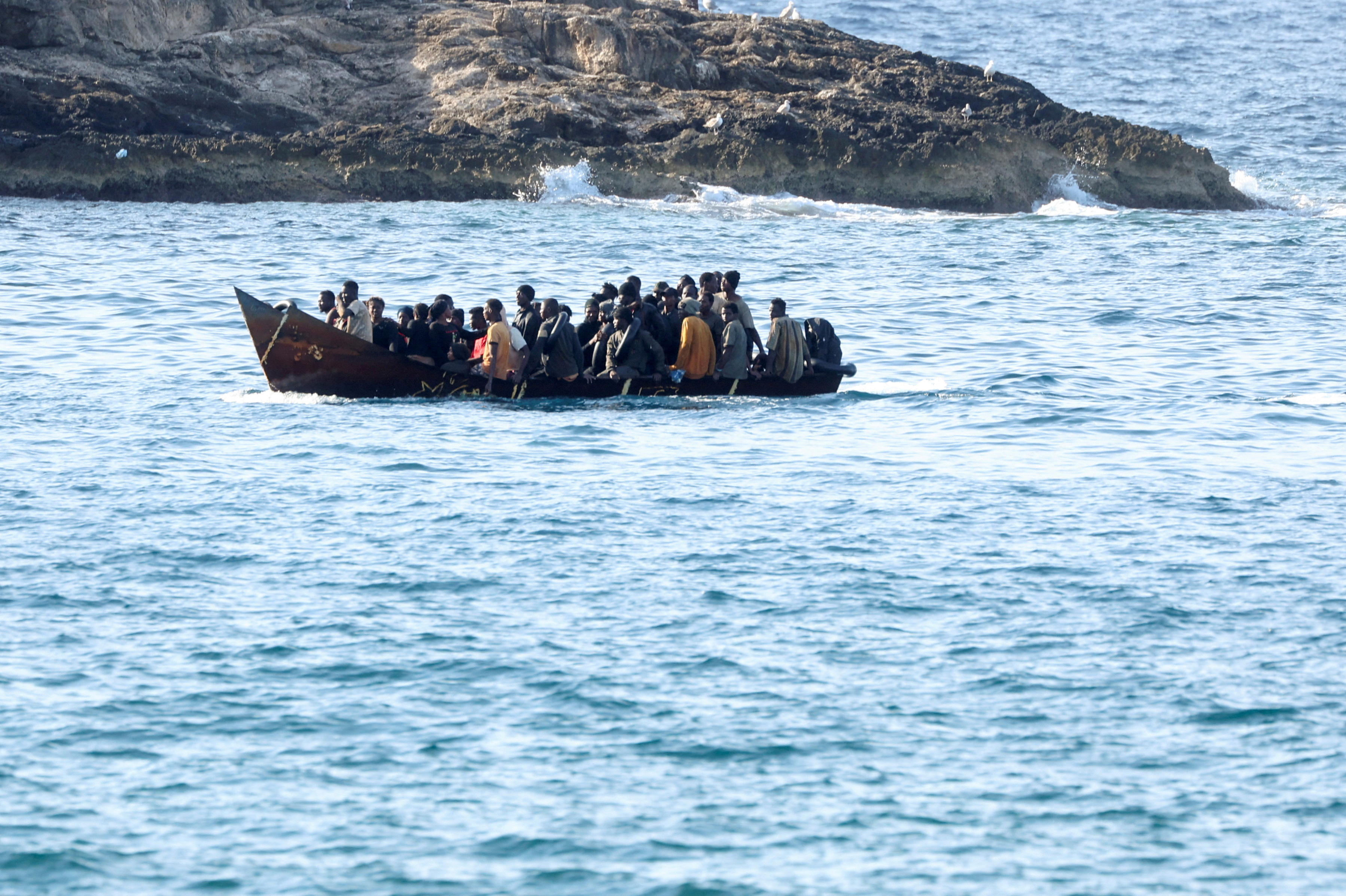 FILE PHOTO: Migrants on Lampedusa
