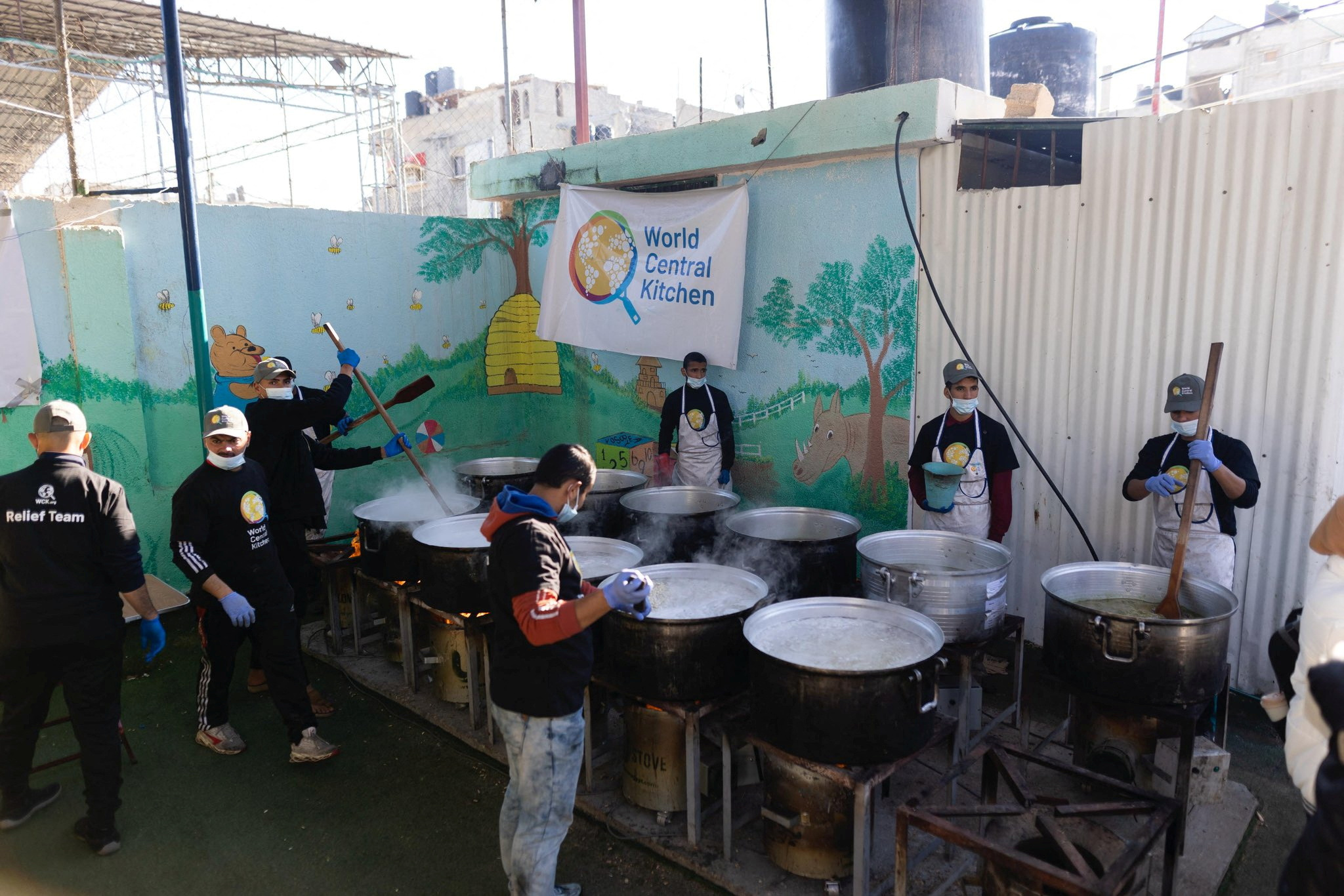 Members of "World Central Kitchen" prepare food for Palestinians, in the location given as Gaza