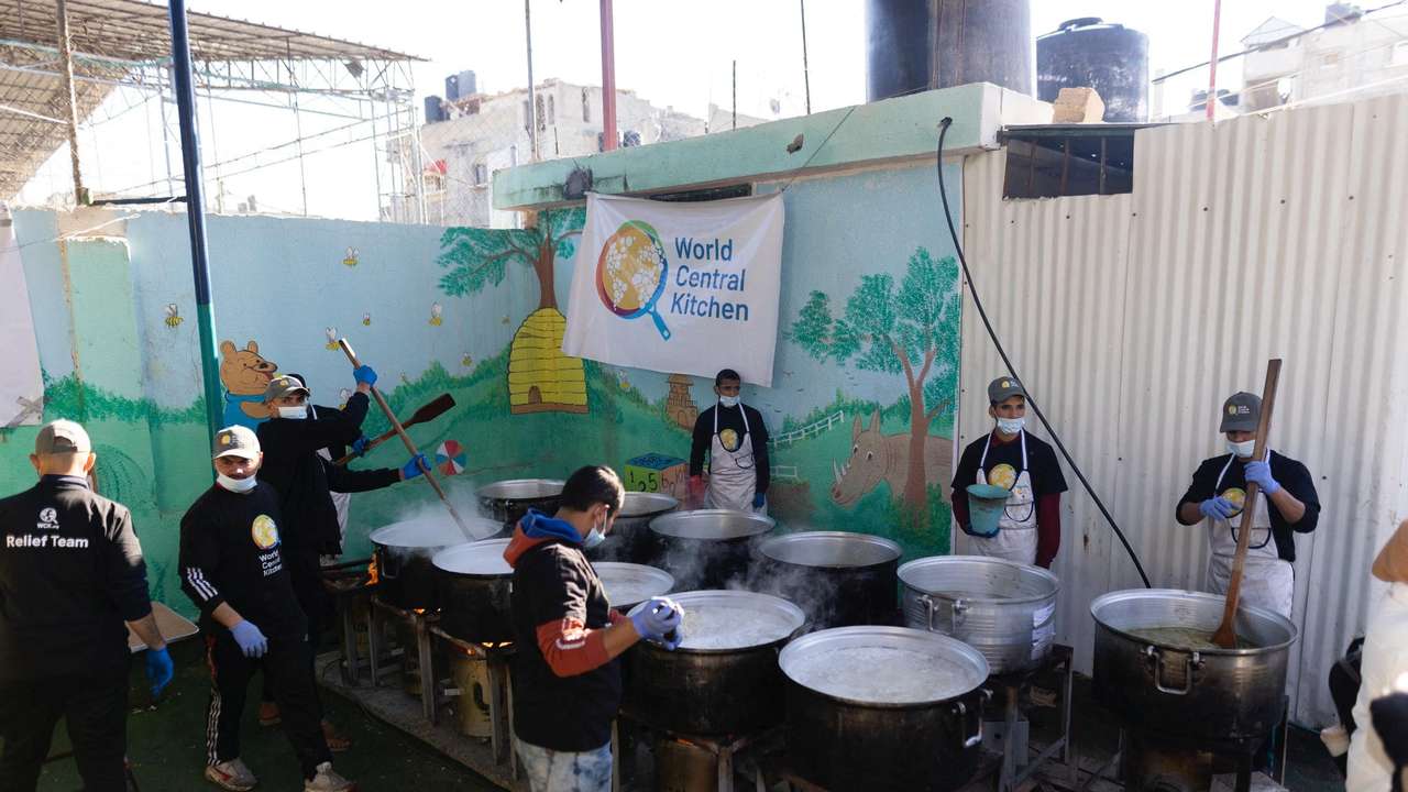 Members of "World Central Kitchen" prepare food for Palestinians, in the location given as Gaza