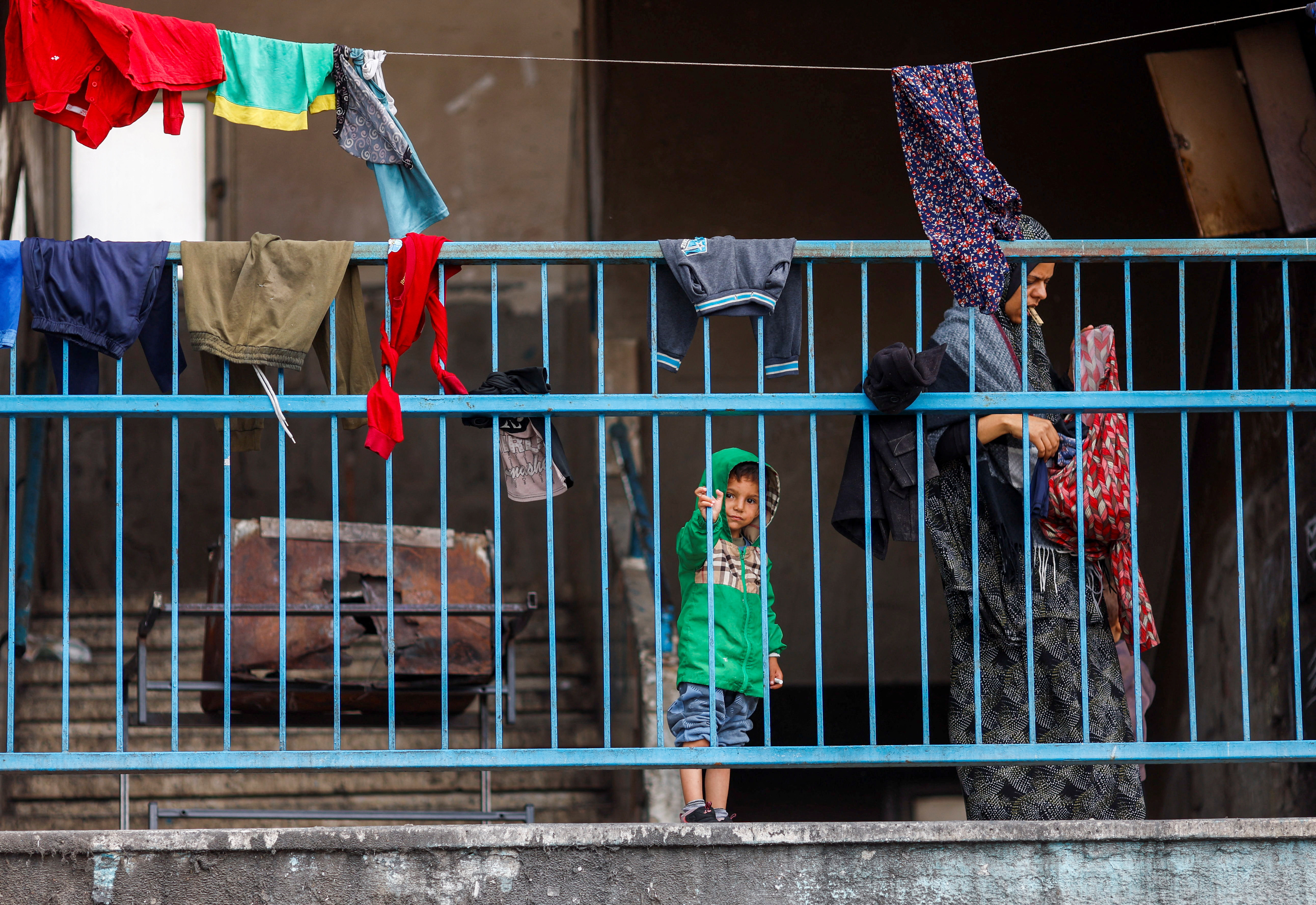 Palestinians prepare to flee Rafah after Israeli forces launched a ground and air operation in the eastern part of the city