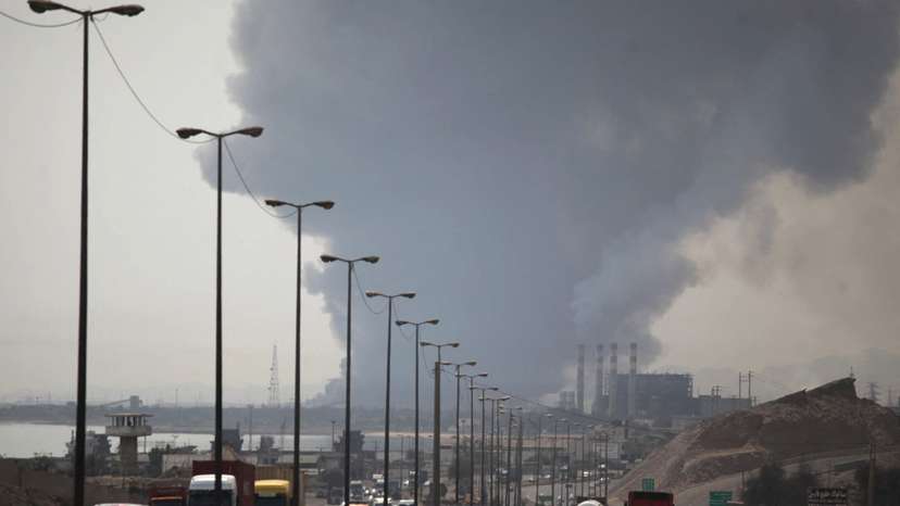 Smoke from the explosion is seen at the Shahid Rajaee port in Bandar Abbas