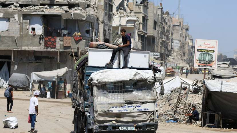 FILE PHOTO: Displaced Palestinians flee from one area to another within Gaza City, amid an Israeli military operation