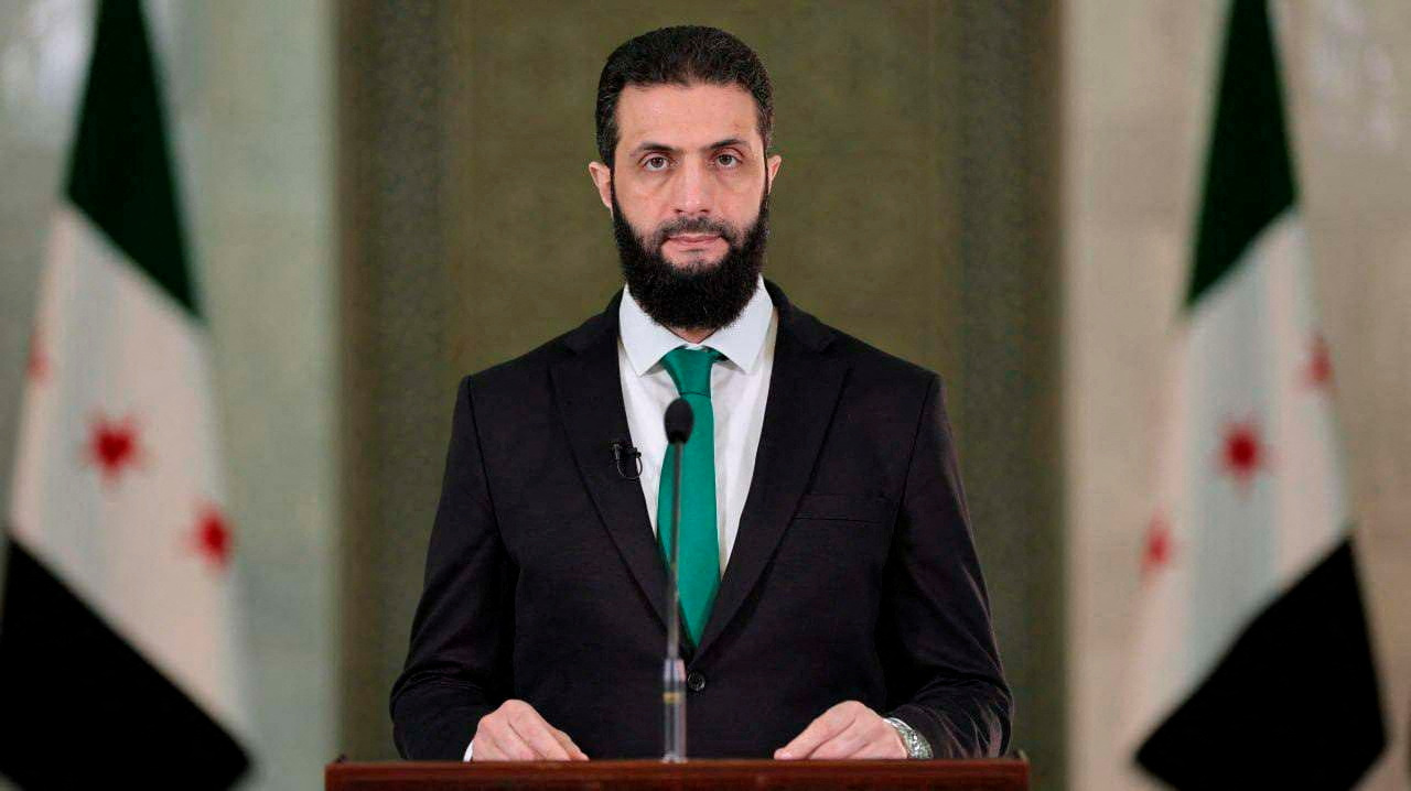 Syria's President Ahmed al-Sharaa delivers a speech at the Presidential Palace in Damascus