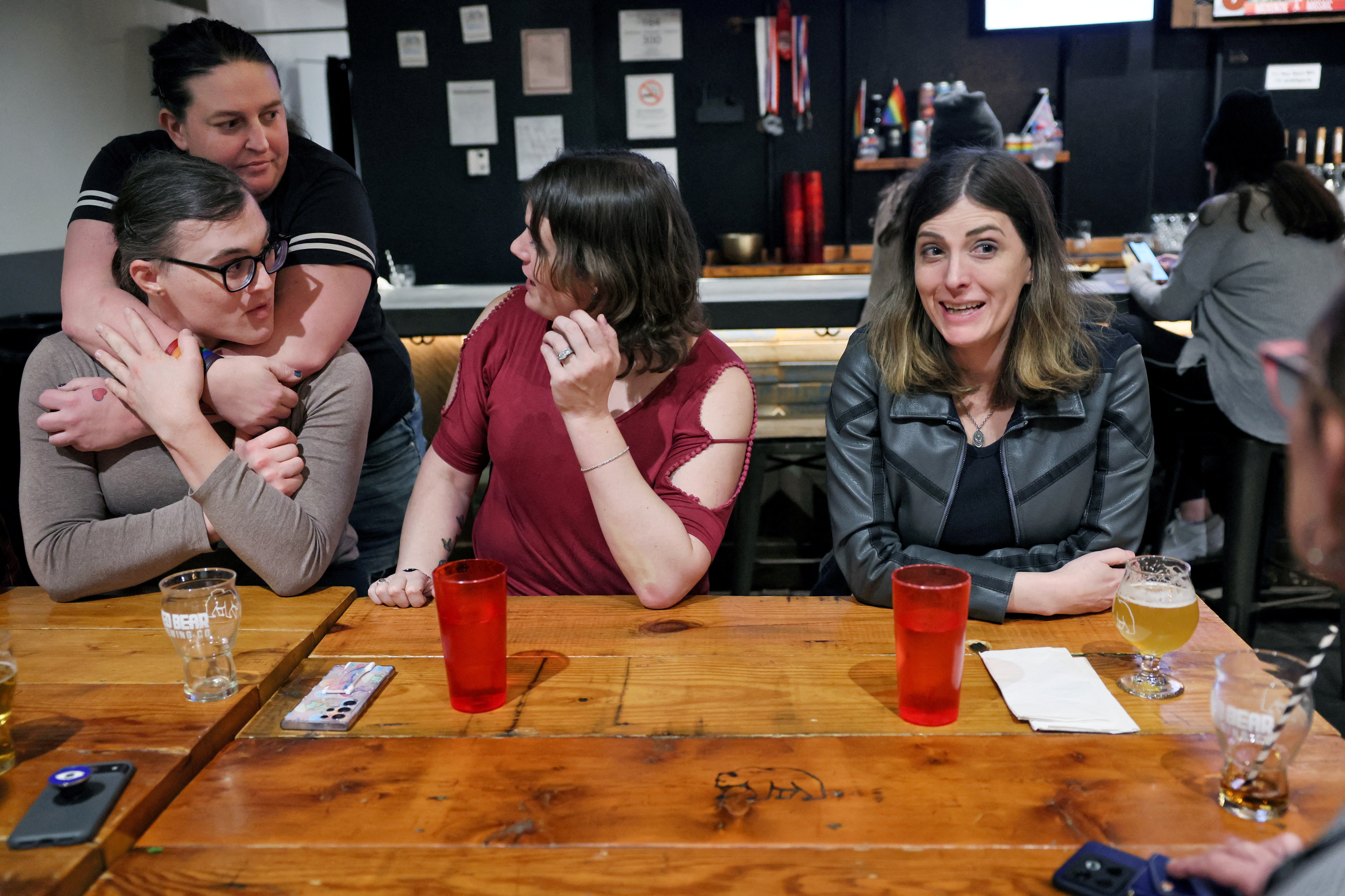 Members of SPARTA and their loved ones meet up at a bar in Washington