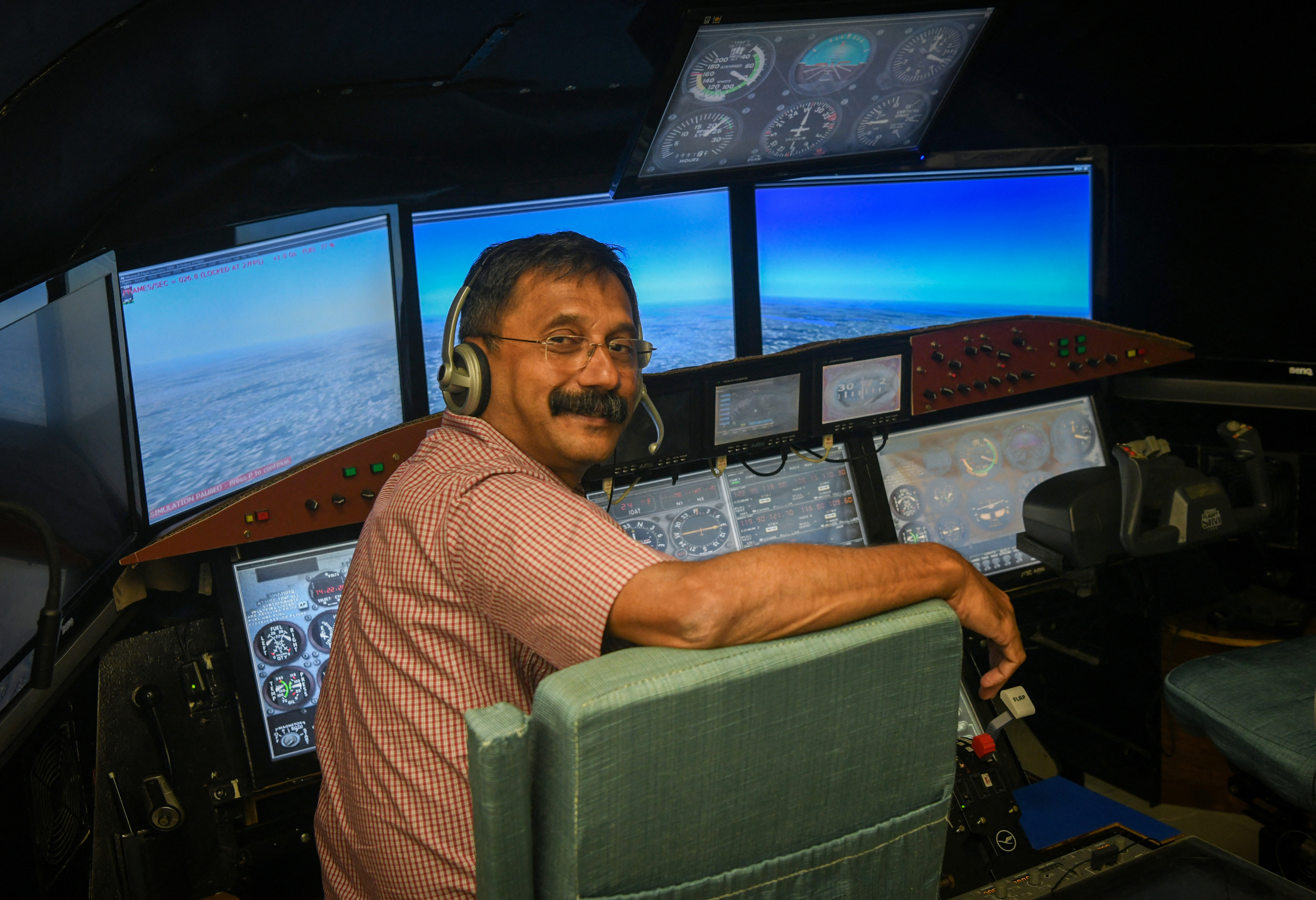 Retired IAF wing commander K. Dinesh poses for a picture after an interview with Reuters in Bengaluru