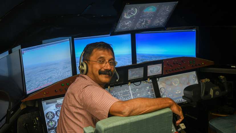 Retired IAF wing commander K. Dinesh poses for a picture after an interview with Reuters in Bengaluru