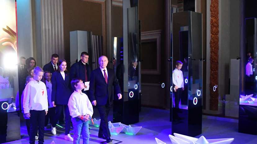 Russian President Putin visits an exhibition in Moscow