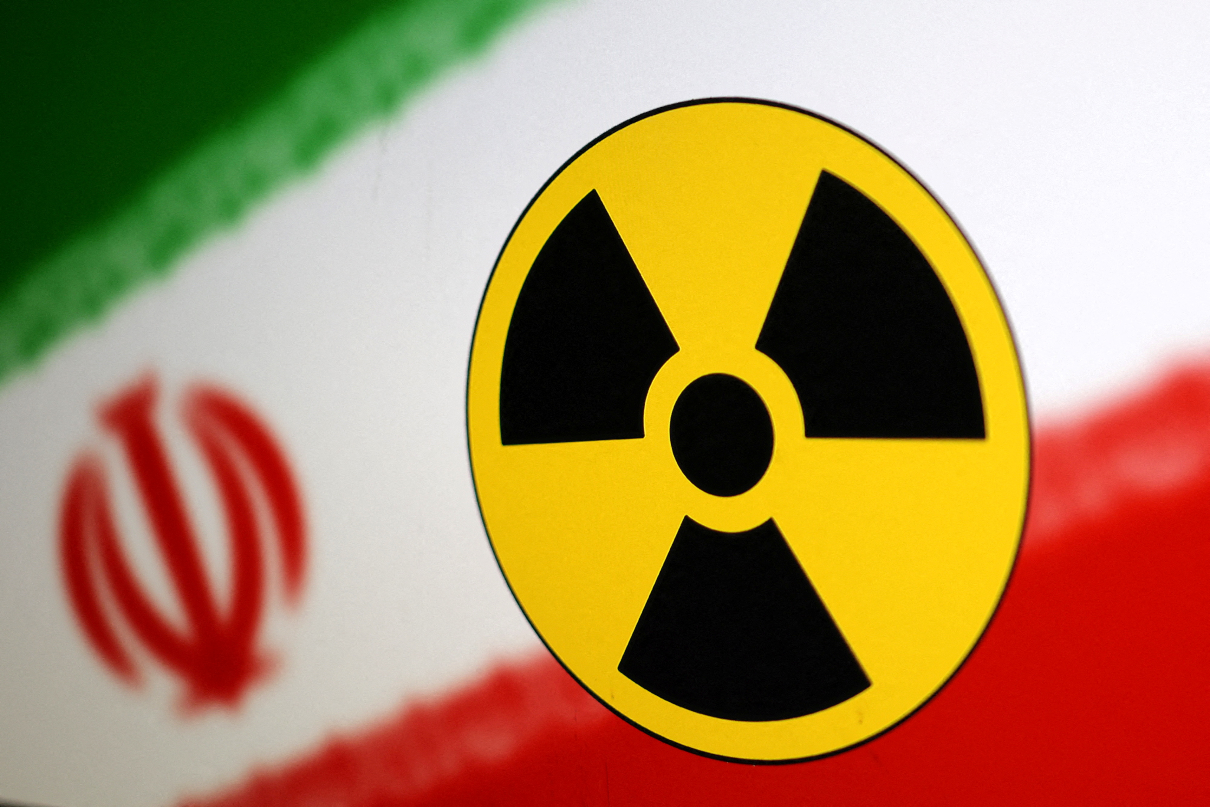 Illustration shows Nuclear symbol and Iran flag