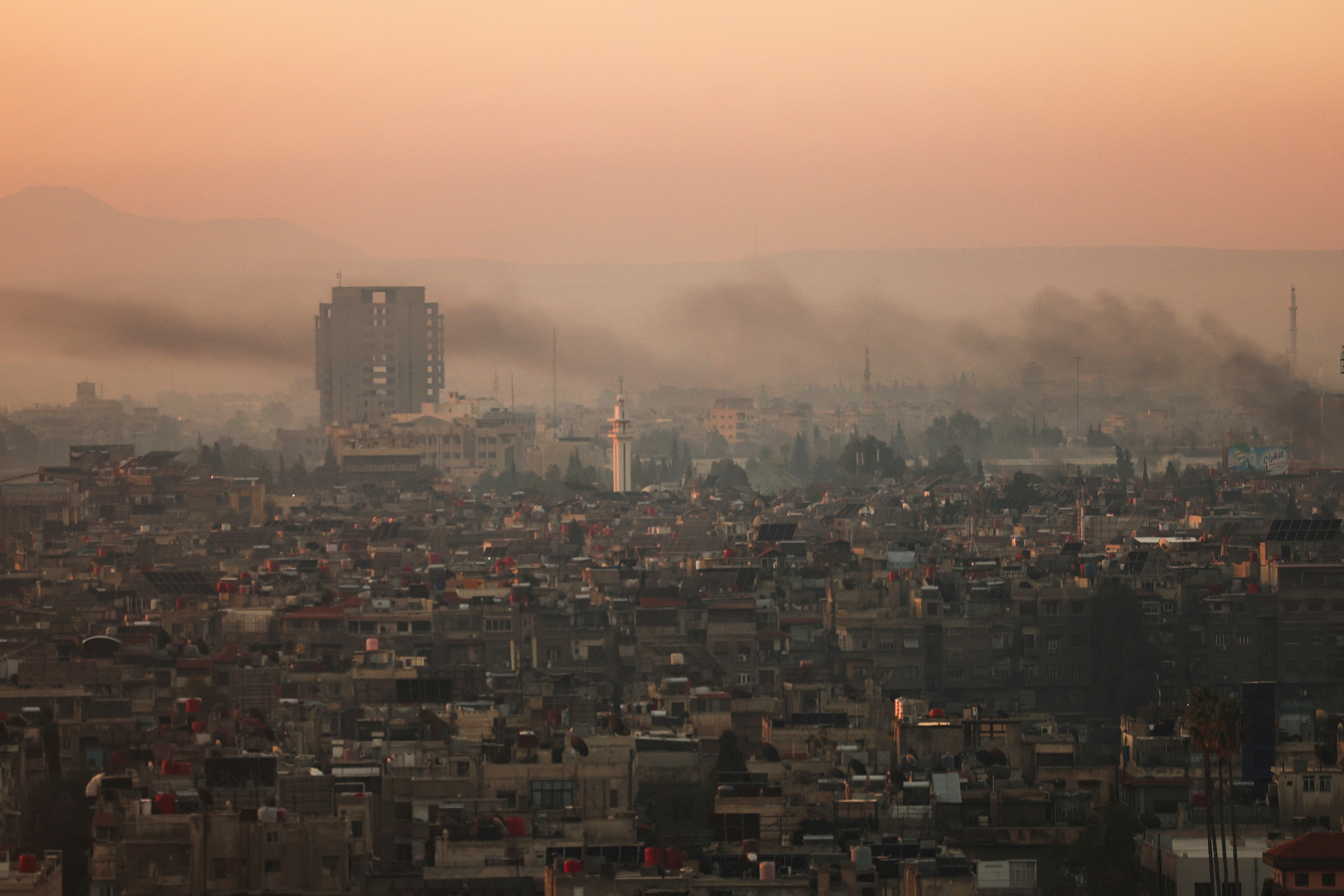FILE PHOTO: A general view of the city during the year's first sunrise on New Year's Day, in Damascus