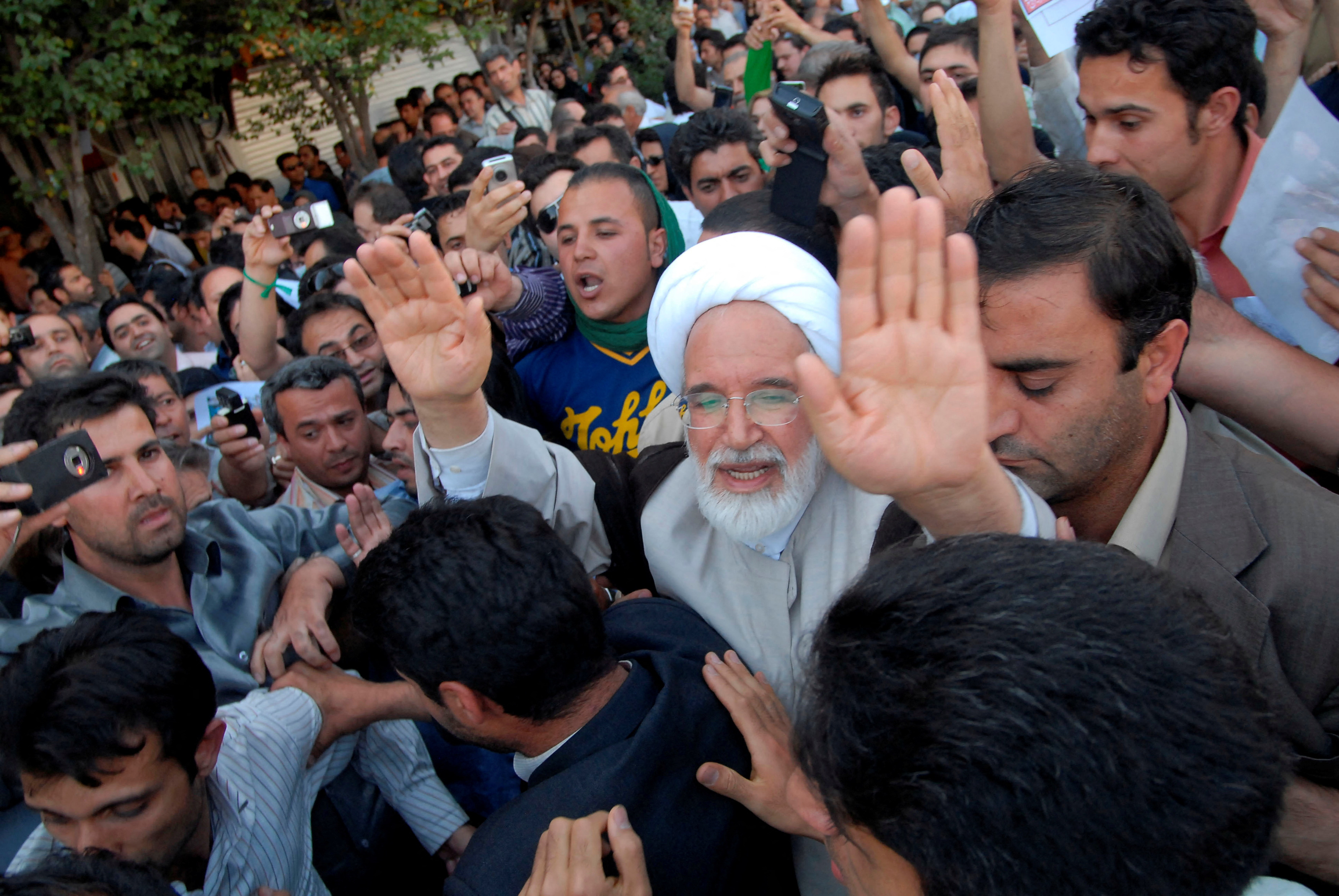 FILE PHOTO: Iran's presidential candidate Karroubi joins a crowd of supporters in Tehran
