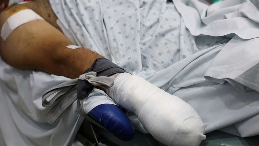 FILE PHOTO: An injured man undergoes an operation at a hospital in Beirut