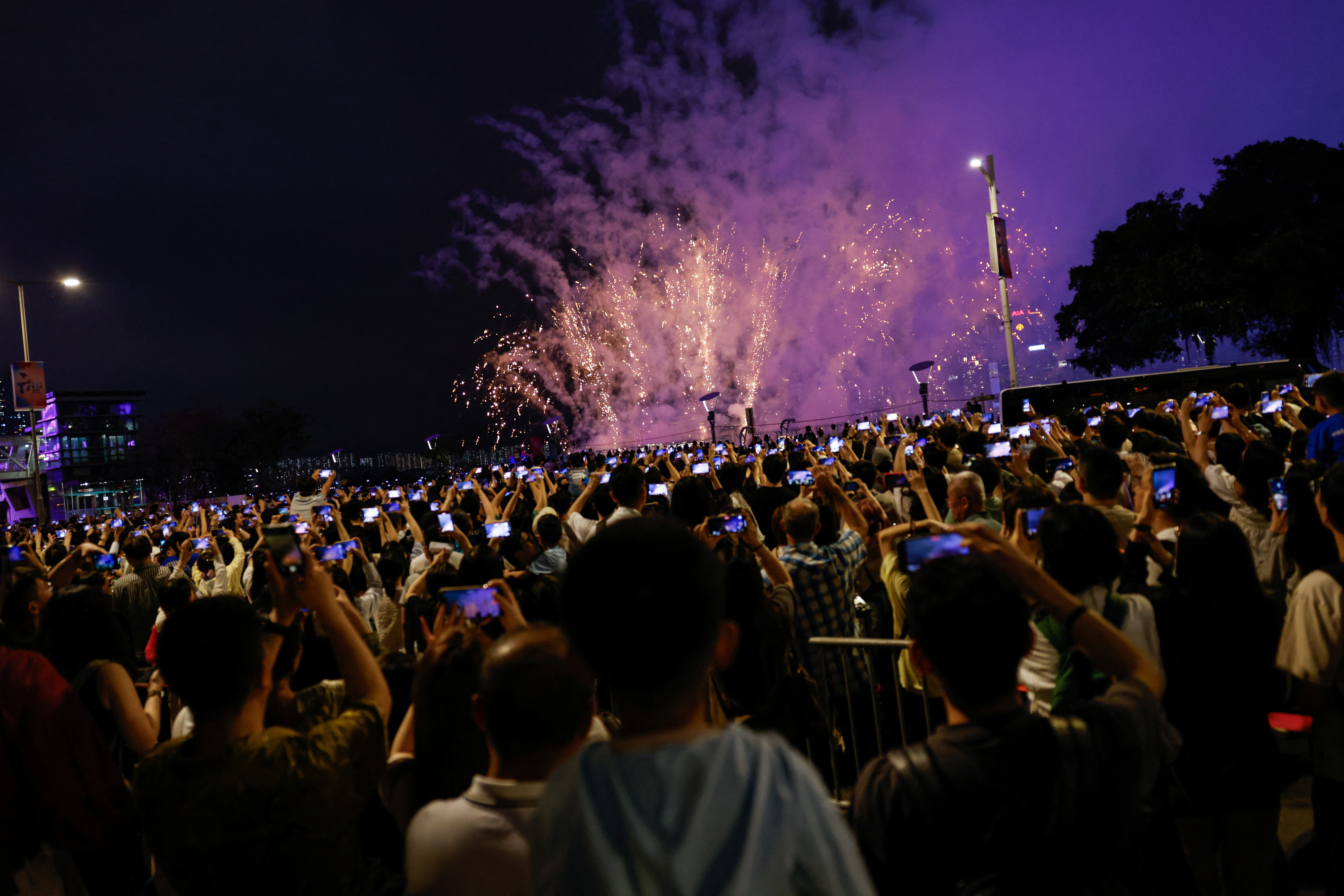 Fireworks light up over Victoria Harbour for the Chinese Labour Day 'Golden Week' holiday, in Hong Kong
