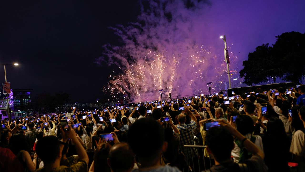 Fireworks light up over Victoria Harbour for the Chinese Labour Day 'Golden Week' holiday, in Hong Kong