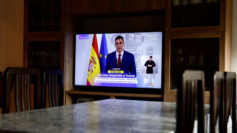 TV screen shows live broadcast of Spain's Prime Minister Pedro Sanchez delivering a statement, at a house in Ronda