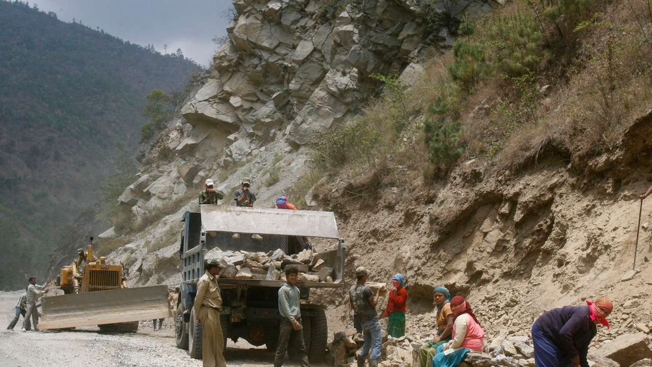 FILE PHOTO: Labourers work on India's Tezpur-Tawang highway which runs to the Chinese border in the northeastern Indian state of Arunachal Pradesh