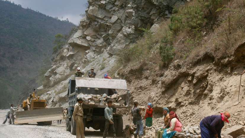 FILE PHOTO: Labourers work on India's Tezpur-Tawang highway which runs to the Chinese border in the northeastern Indian state of Arunachal Pradesh