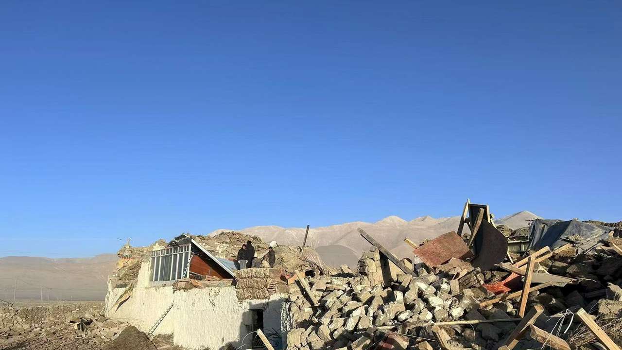 Damaged houses are pictured after an earthquake in Shigatse