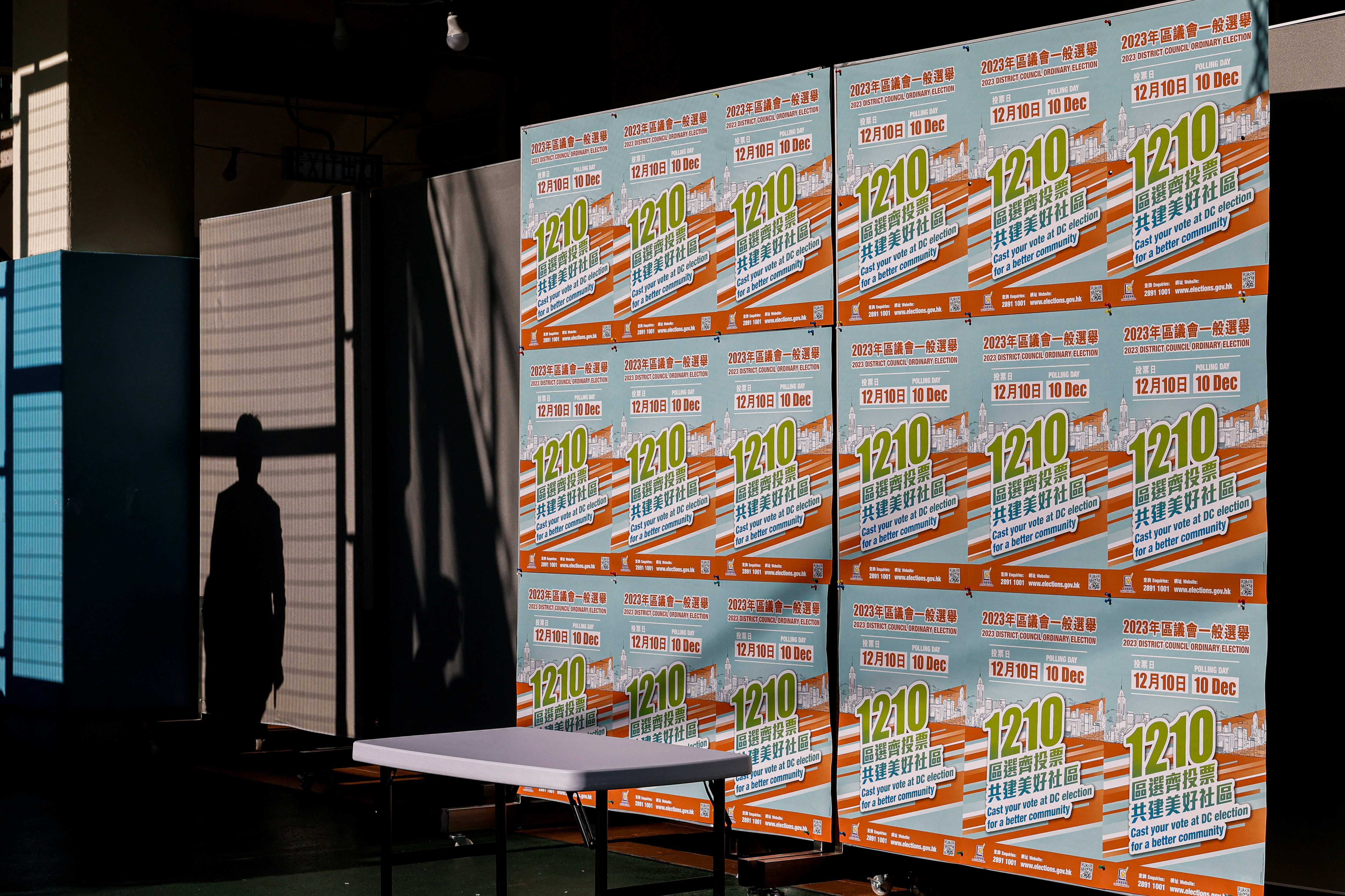 Posters encouraging people to vote in the District Council Election are seen at a polling station in Hong Kong