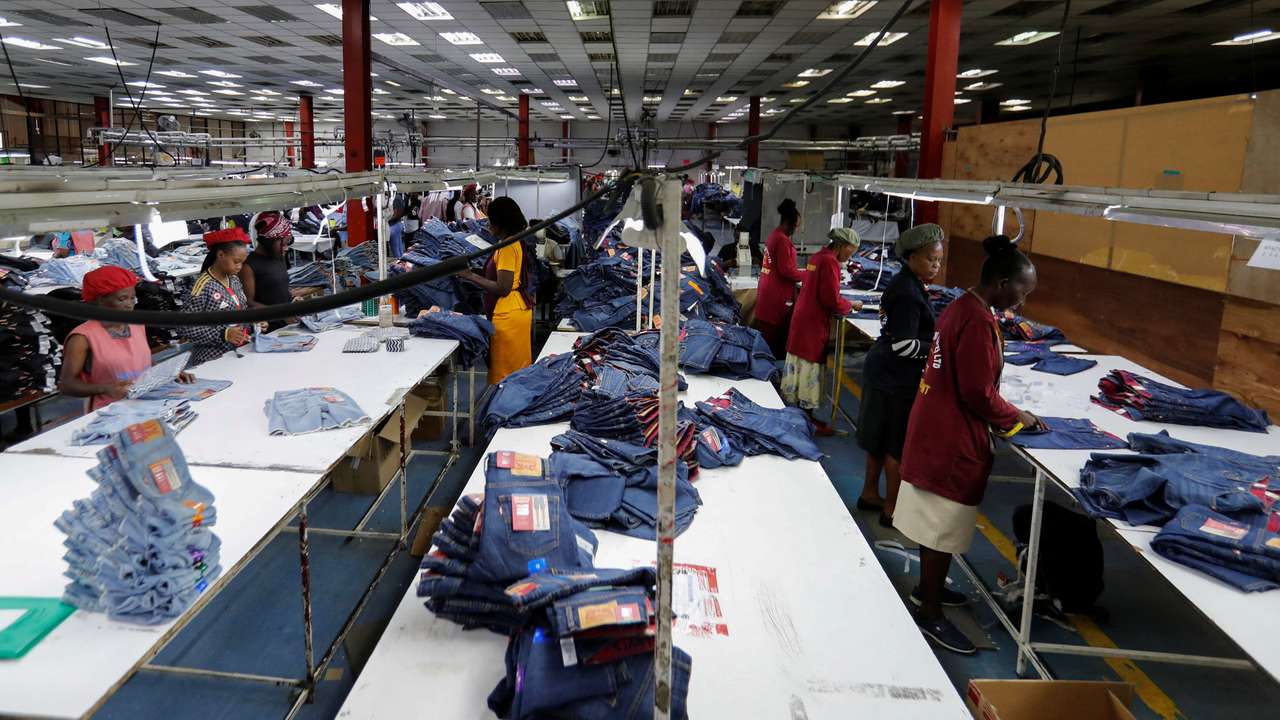 Kenyan workers check clothes made for export at the United Aryan EPZ factory in Ruaraka district of Nairobi
