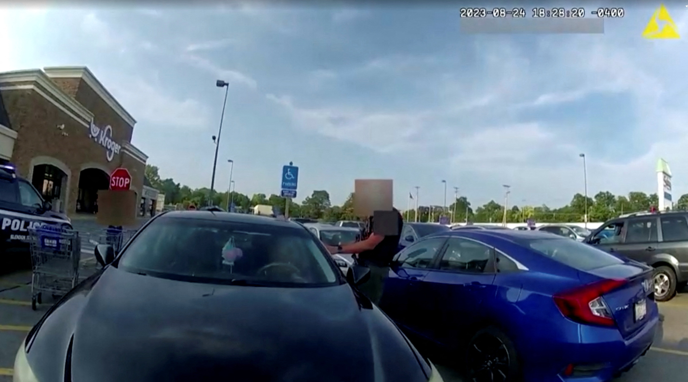 Screen capture obtained from a body camera footage showing an officer fatally shooting a pregnant Black woman in the parking lot of a grocery store in Blendon