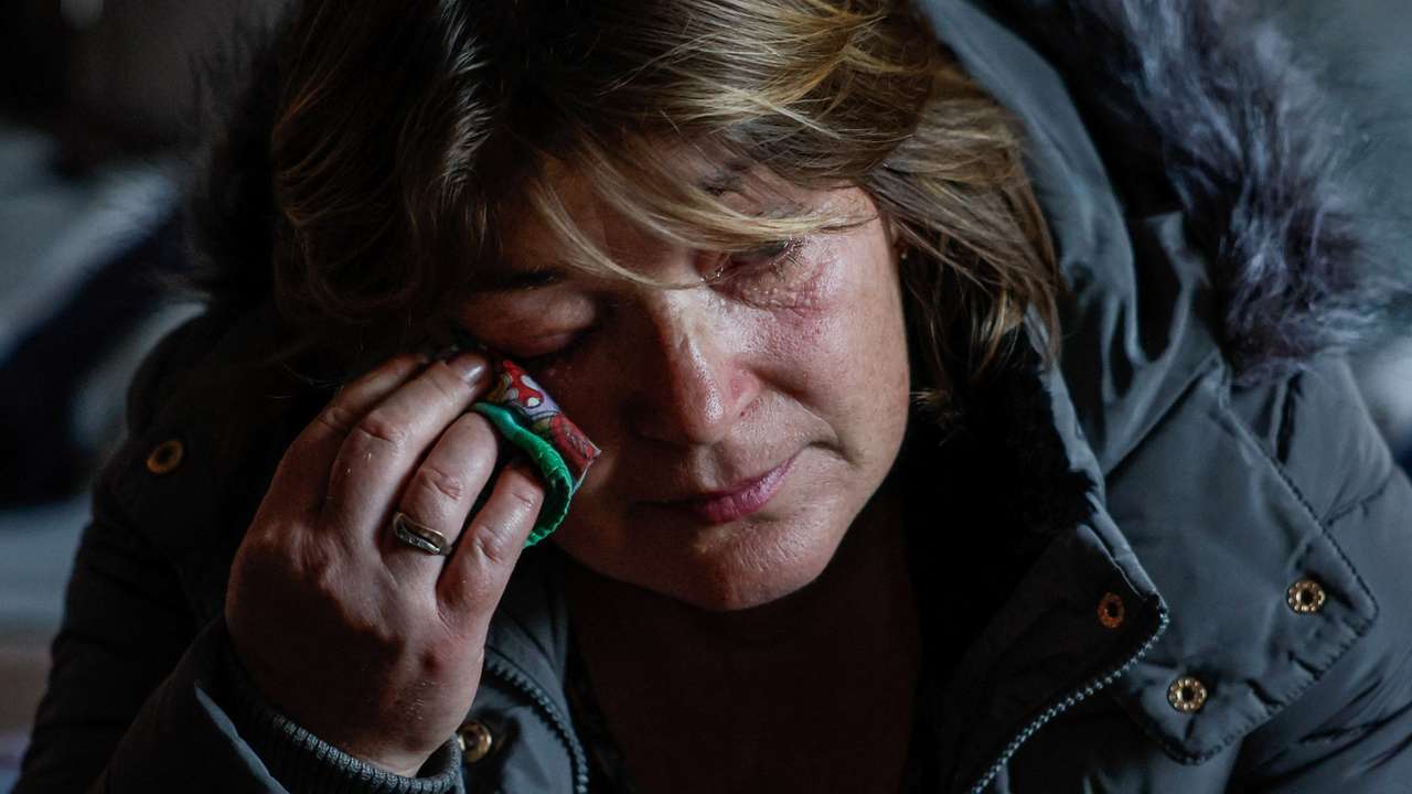 Woman, an IDP from the town of Toretsk, reacts after evacuation at a temporary shelter in Kostiantynivka