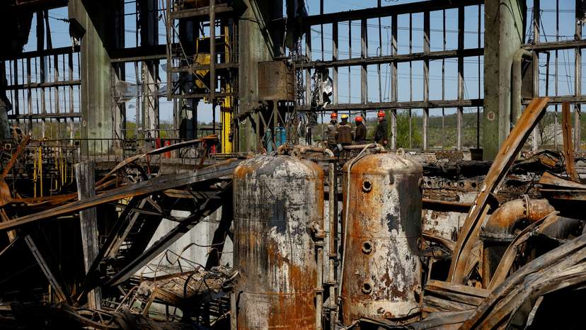 FILE PHOTO: Employees work at a thermal power plant heavily damaged by recent Russian missile strikes in Ukraine