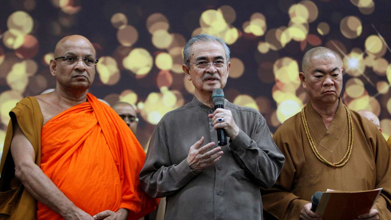 FILE PHOTO: Malaysia's former prime minister Abdullah Ahmad Badawi takes part in multi-religion mass prayers for the passengers of Malaysian Airlines flight MH370 at Kuala Lumpur International Airport in Sepang