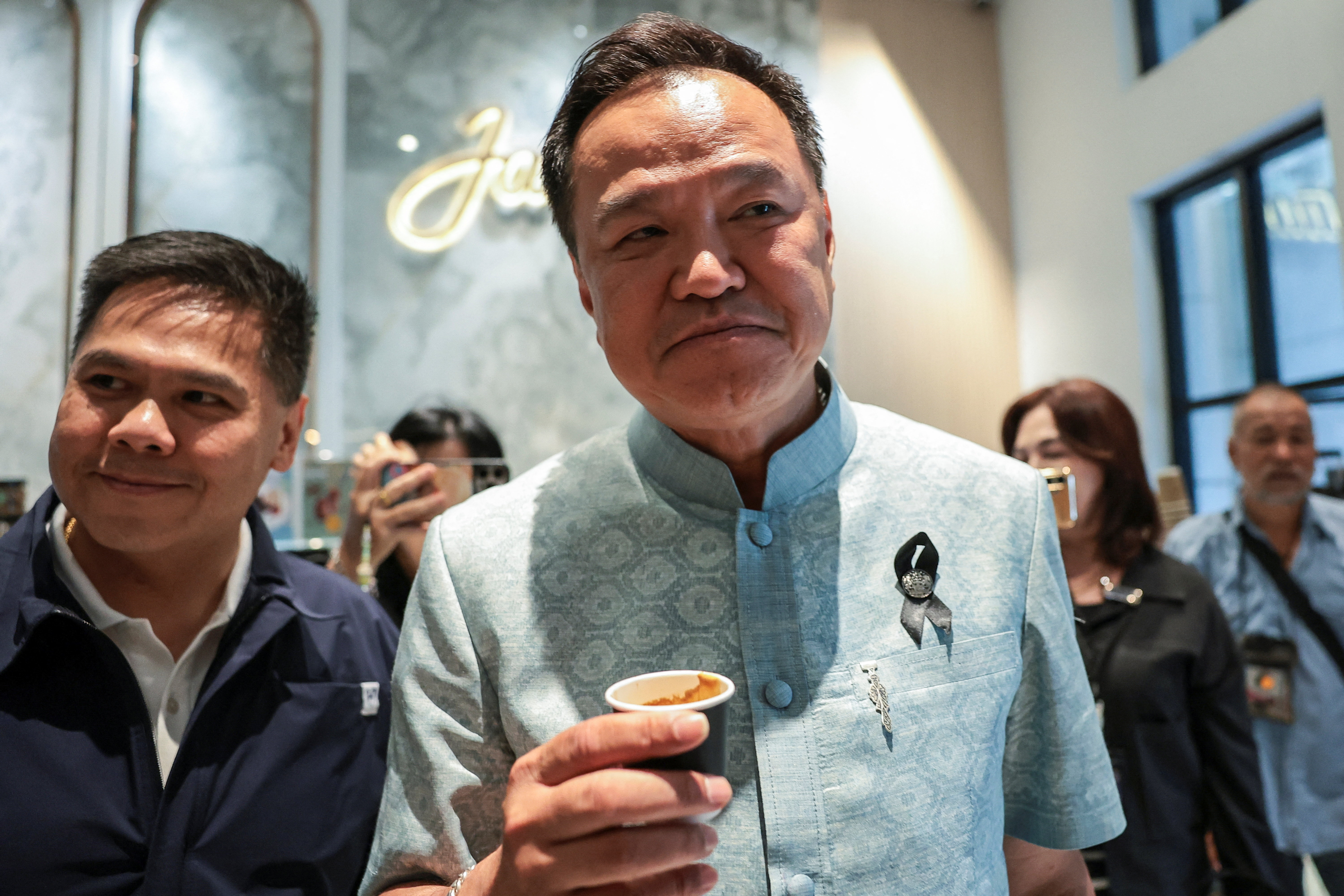 Thailand's caretaker PM Anutin Charnvirakul attends a meeting with Bhumjaithai Party members at party HQ in Bangkok