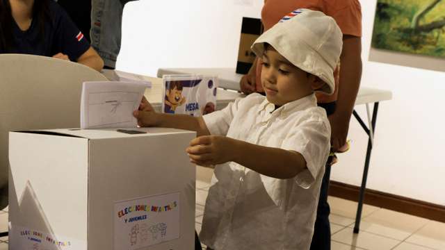 Children take part in a symbolic election at the Children's Museum during Costa Rica's general election day in San Jose
