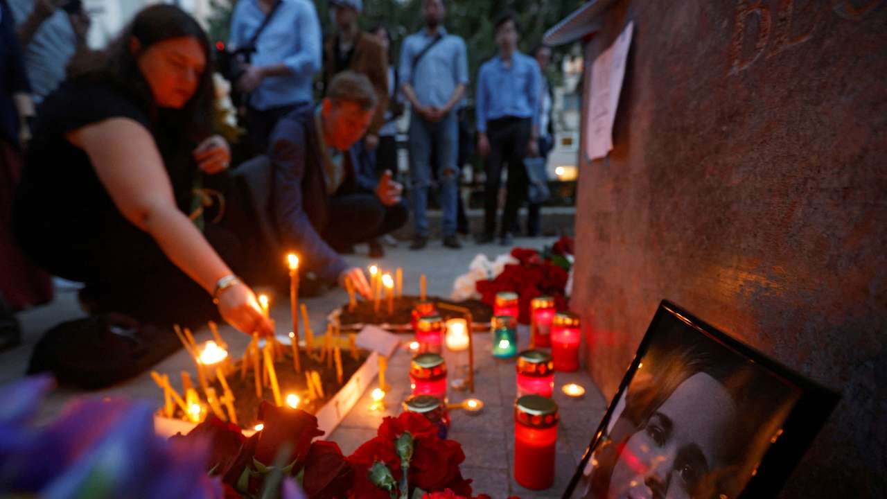 FILE PHOTO: Flowers and candles are placed next to a portrait of Darya Dugina in Moscow