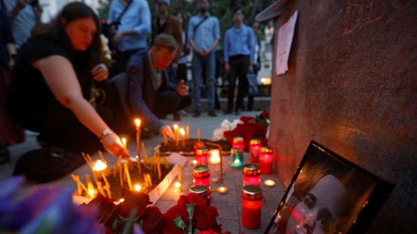 FILE PHOTO: Flowers and candles are placed next to a portrait of Darya Dugina in Moscow