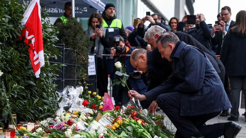 German Chancellor Scholz visits a makeshift memorial for the victims of a suspected ramming attack, in Munich