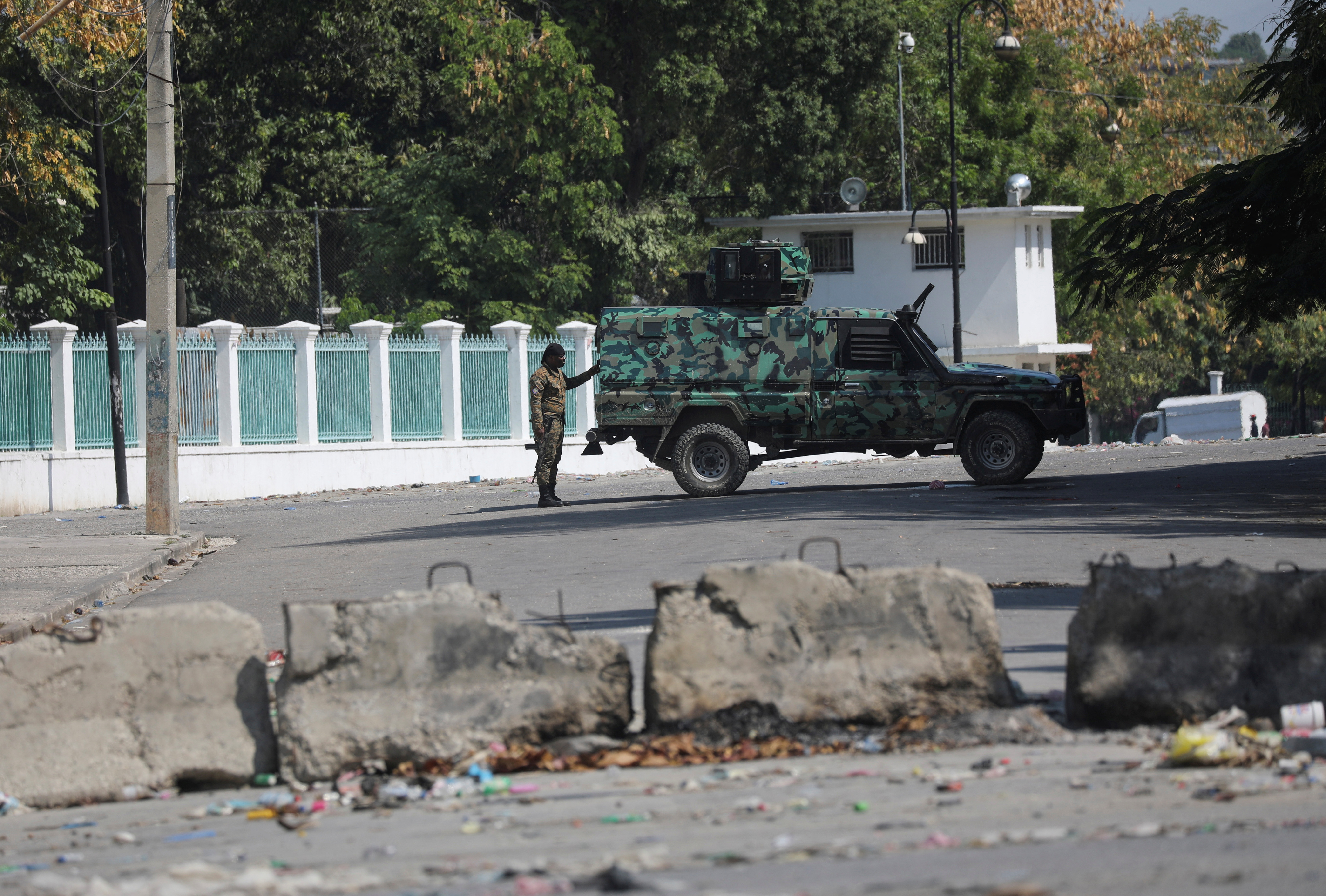 After prime minister pledges to step down, uneasy quiet in Haiti capital