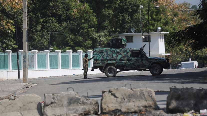 After prime minister pledges to step down, uneasy quiet in Haiti capital