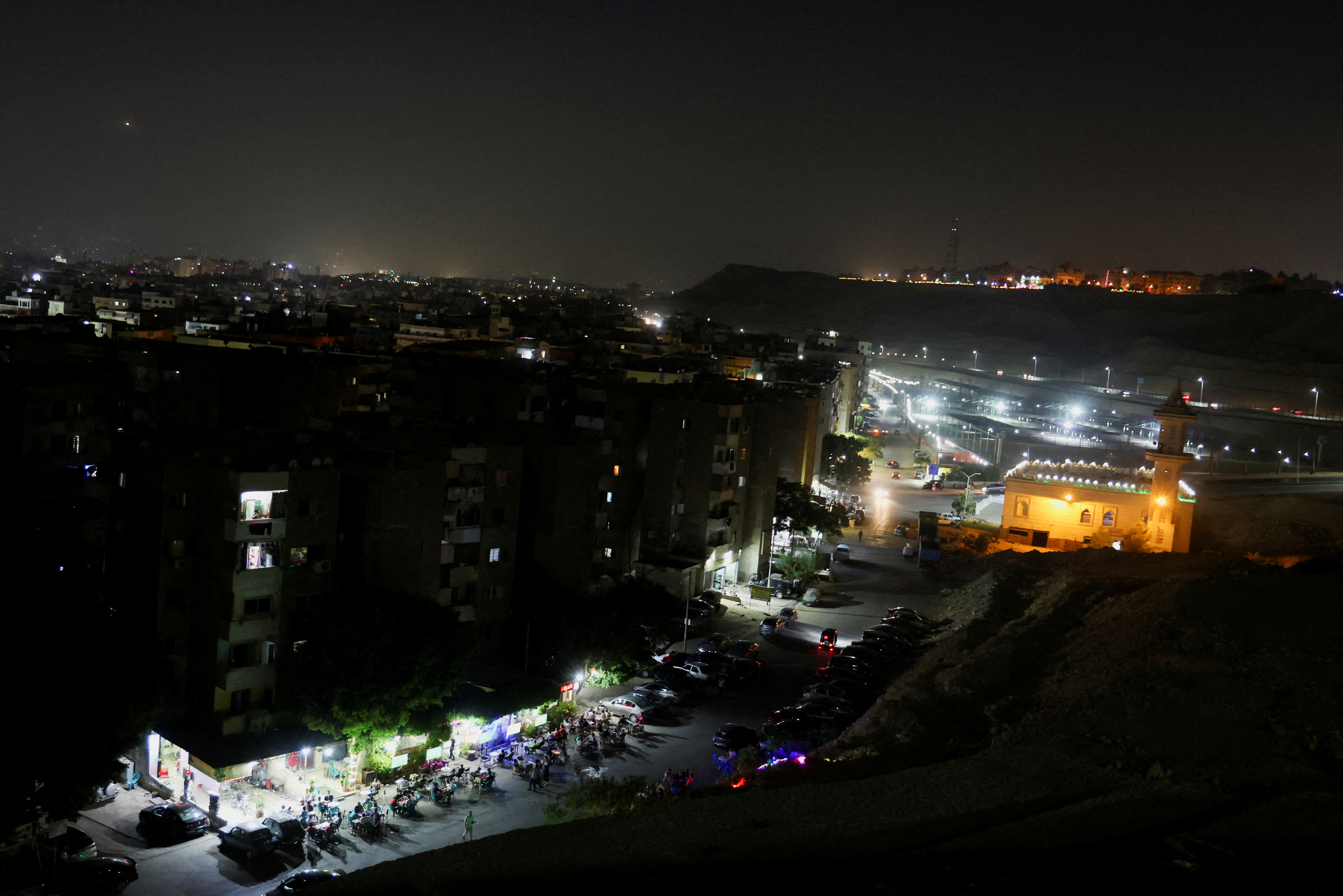 FILE PHOTO: A general view shows different dark areas in the capital Cairo