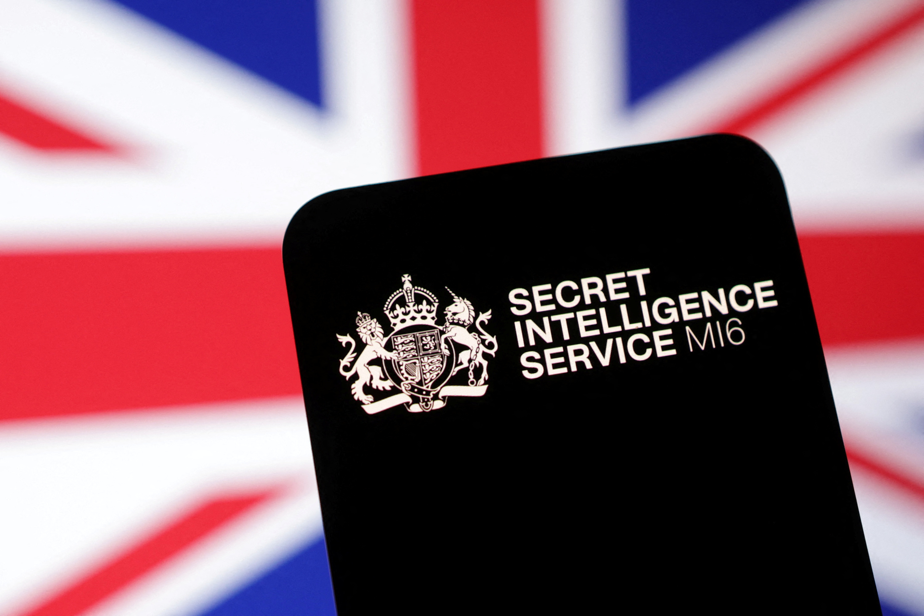 Illustration shows MI6 (Secret Intelligence Service) logo and UK flag