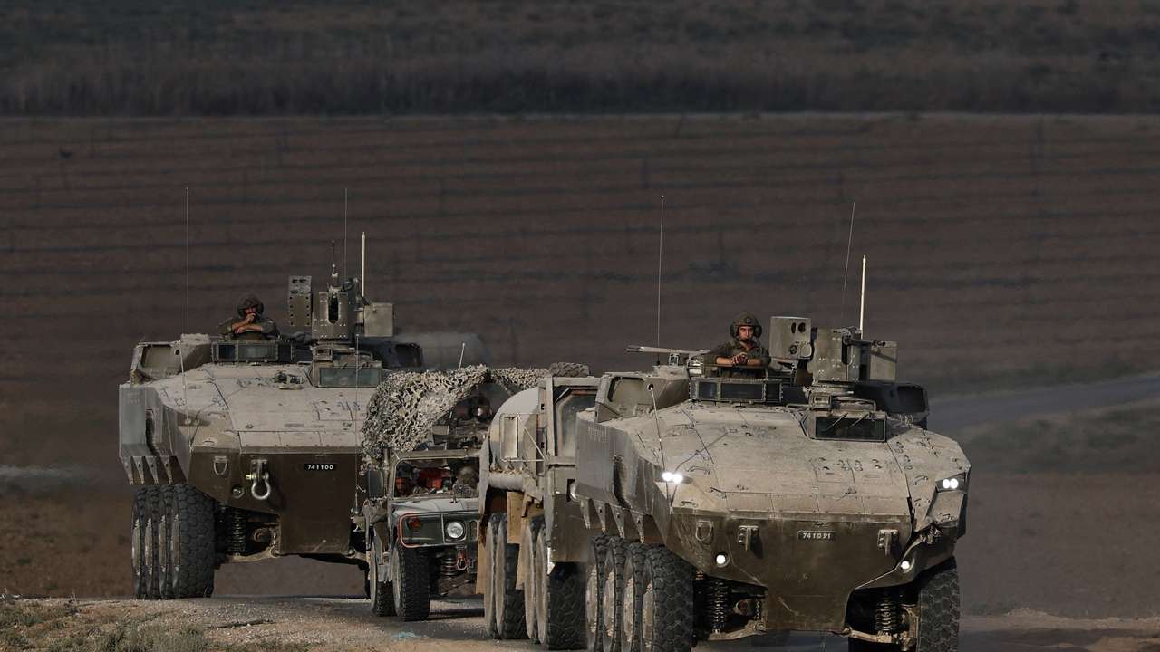 An Israeli military convoy manoeuvres on Israeli side of the Israel-Gaza border
