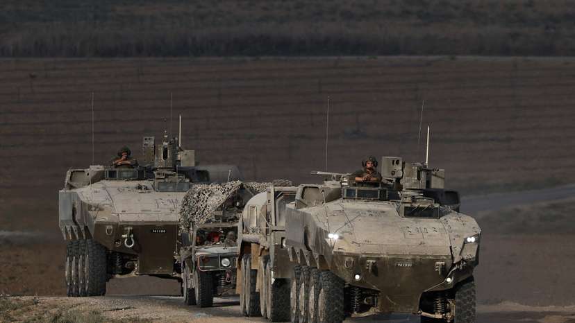 An Israeli military convoy manoeuvres on Israeli side of the Israel-Gaza border