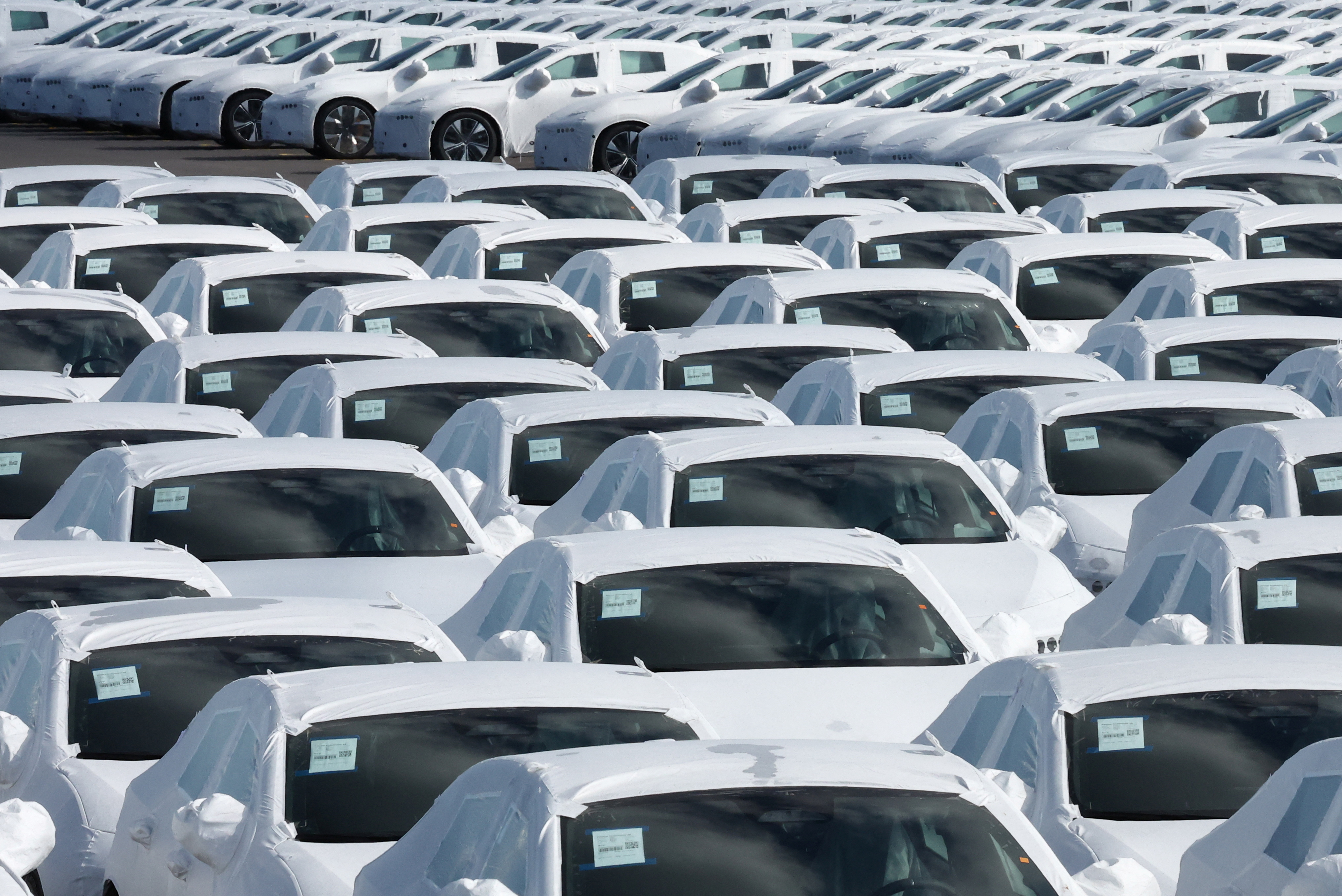New cars are seen parked in the port of Zeebrugge