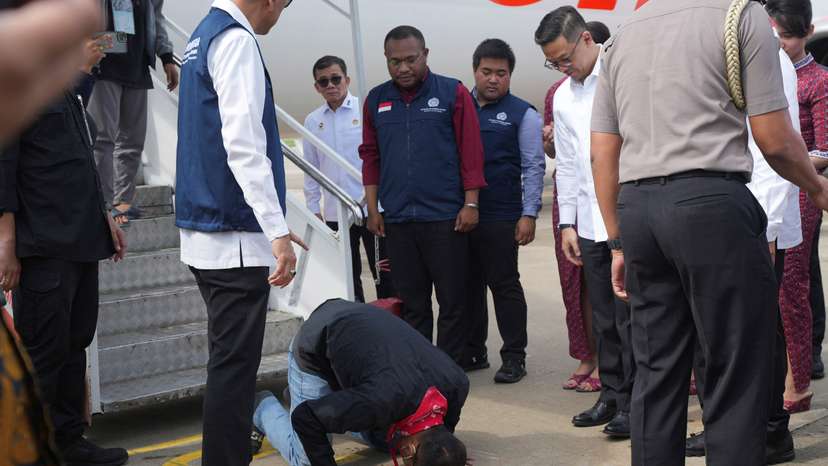 An Indonesian national rescued from Myanmar's scam centres reacts upon his arrival from Thailand, at Soekarno-Hatta International airport in Tangerang