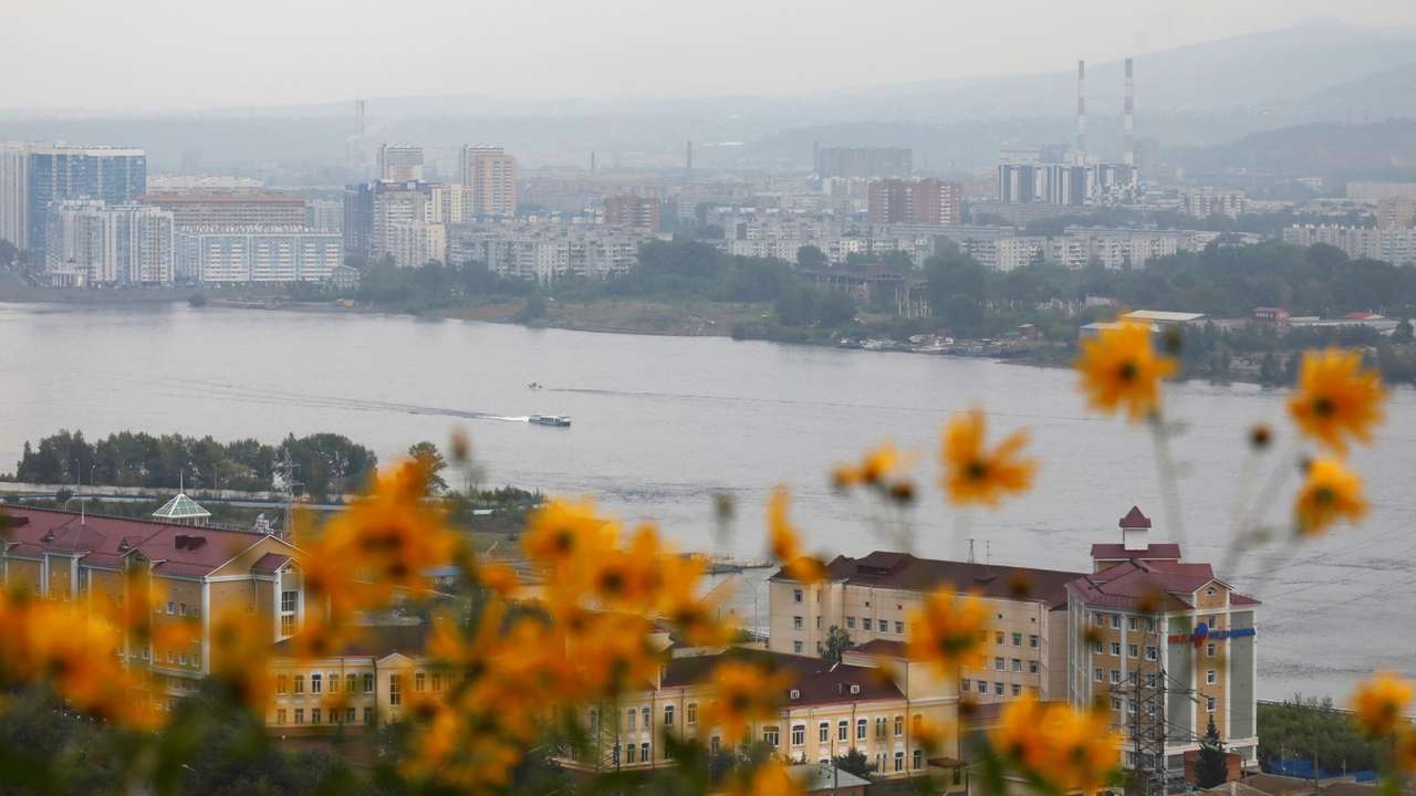 FILE PHOTO: Vessels sail along the Yenisei River in Krasnoyarsk