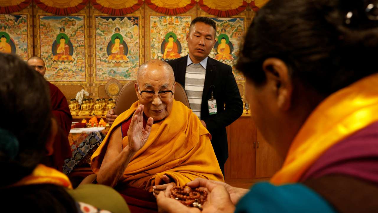 Tibetan spiritual leader, the Dalai Lama, offers blessings to his followers at his Himalayan residence in Dharamshala