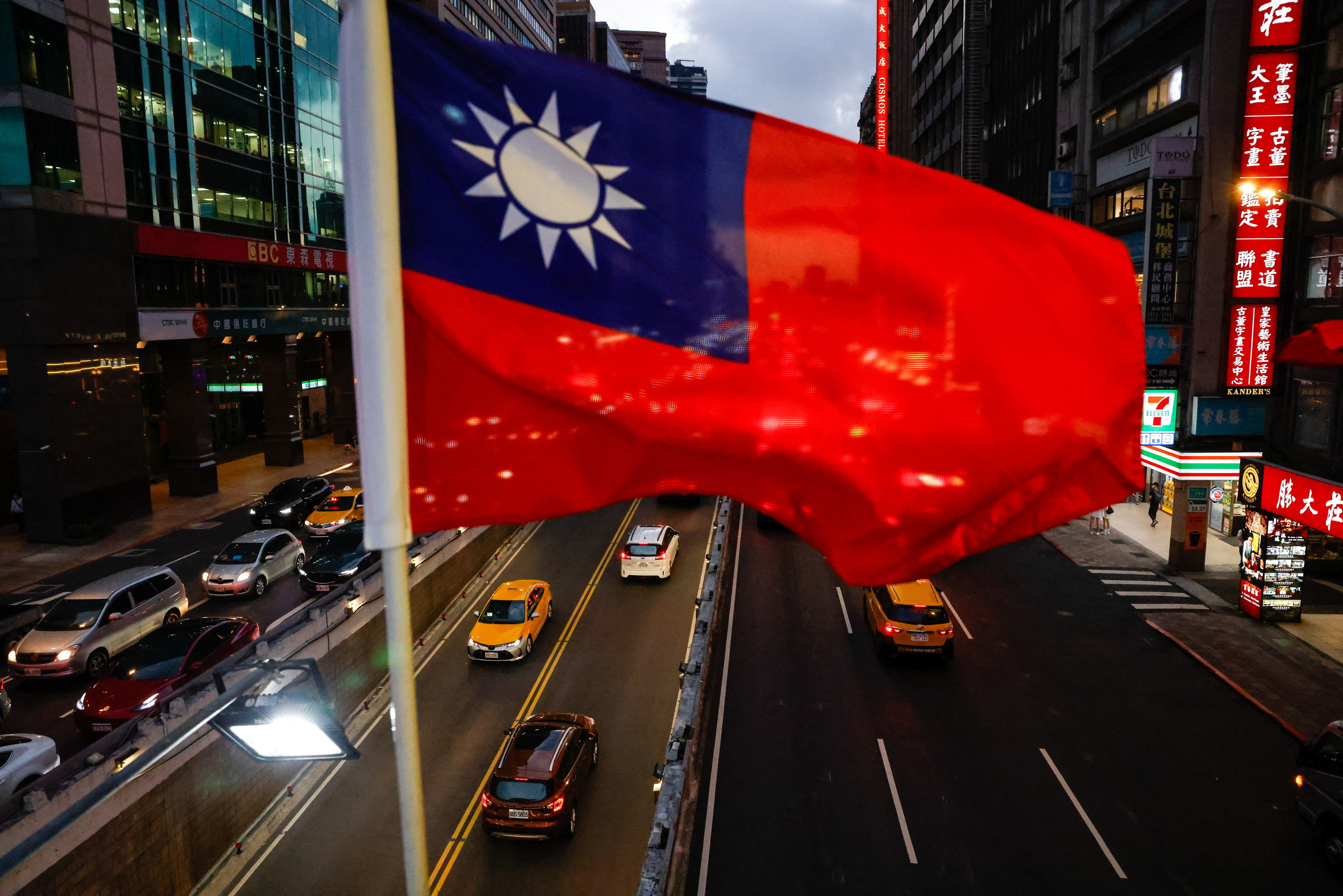 A Taiwan flag can be seen on an overpass ahead of National Day celebrations in Taipei